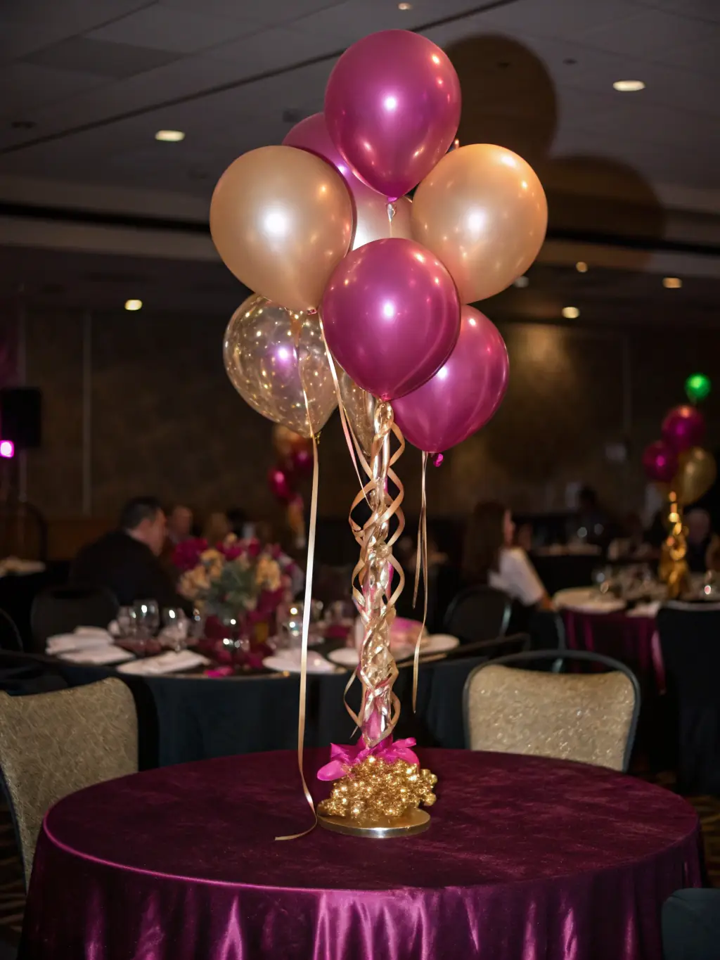 A series of tall, slender balloon columns topped with lush floral arrangements, placed strategically to line the aisle or frame the reception area. The columns are in classic white and gold.